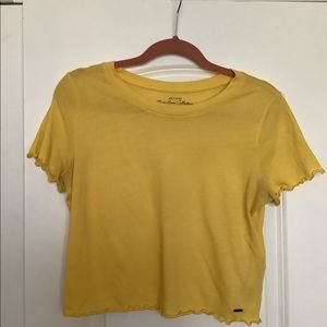 Yellow lettuce hem crop top